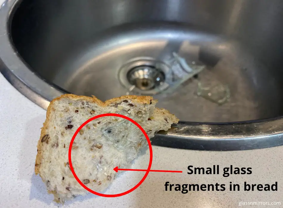 Picking up broken glass from sink