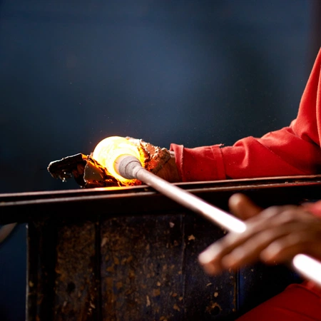 Hot glass being rolled before cooling